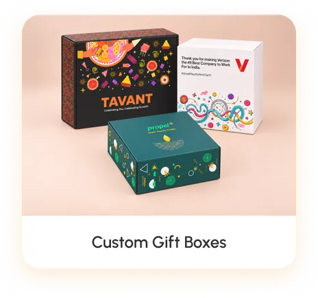 Three corporate gift boxes printed edge to edge with client artwork — one charcoal black, one white, one deep teal